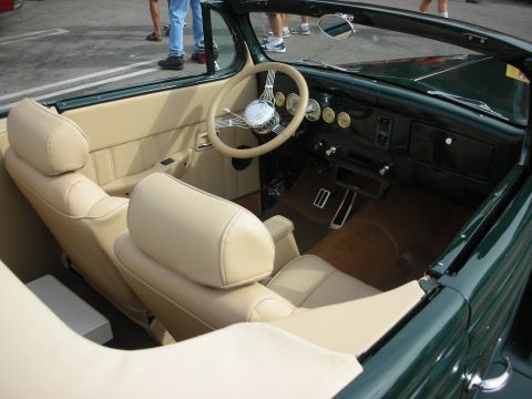 1998 Ford Crown Victoria - Interior of a classic convertible, showing tan seats and dashboard details.