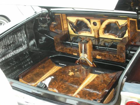 1998 Ford Crown Victoria - This trunk features elaborate wood grain paneling and custom audio system installation.
