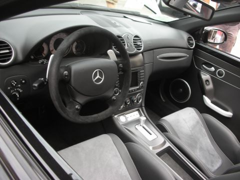 1998 Ford Crown Victoria - Interior of a Mercedes-Benz showing the dashboard, steering wheel, and seats.