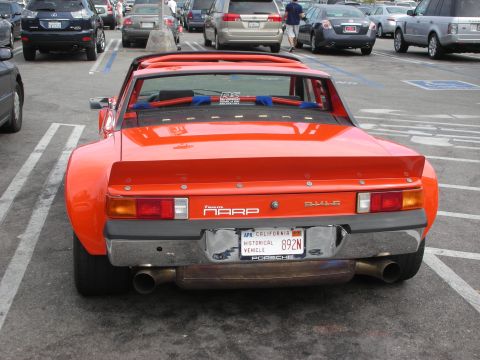 1998 Ford Crown Victoria - Rear view of an orange Porsche 914 with a wide body kit and a California historical vehicle plate.