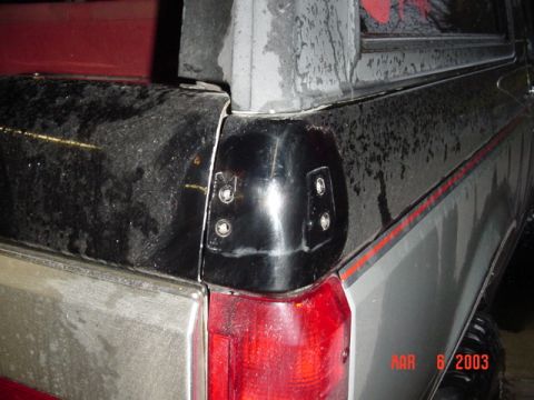 1989 Ford Bronco - Rear corner detail of a pickup truck, showing the taillight and fender flare. Date stamp visible.