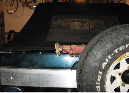 1995 Ford Bronco - 1995 Ford Bronco rear view with a Hi-Lift jack attached and spare tire in place.