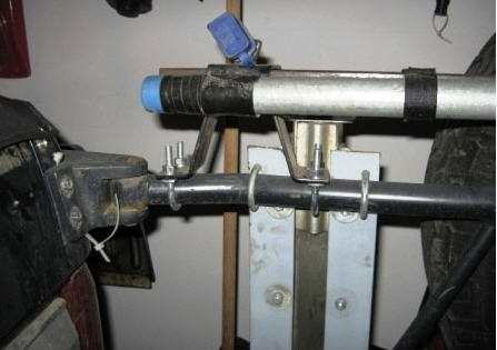 1995 Ford Bronco - A hi-lift jack is mounted to the side of a vehicle, likely for off-road use.