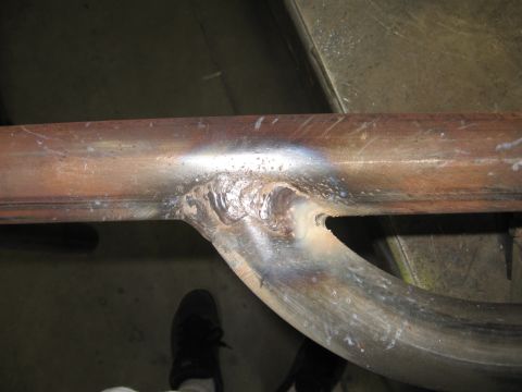 1991 Ford Bronco - Welded metal tubing with visible weld marks and some discoloration.