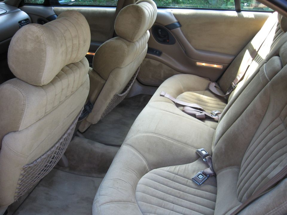 Tan interior with velour seats and seatbelts