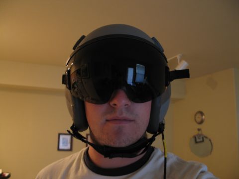 1995 Ford Bronco - A person wears a pilot helmet indoors, with a dark visor obscuring their face.