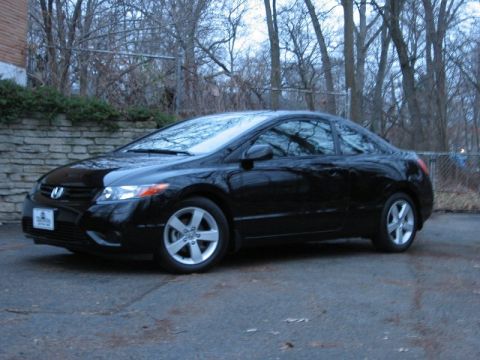 1999 Ford Taurus - Black coupe, 3/4 front view. The body style suggests a 2006-2011 Honda Civic.