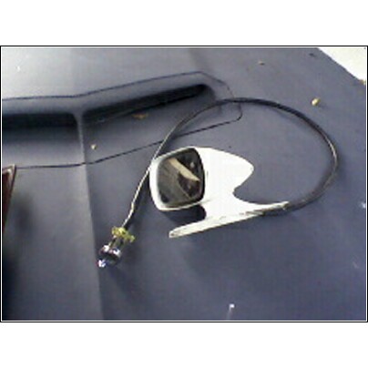 1973 Ford Ranchero - A white side mirror with a black cable is shown resting on a dark car hood.