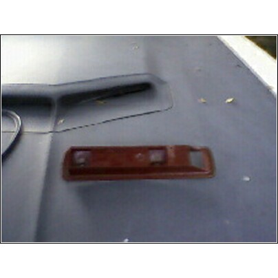 1973 Ford Ranchero - A single car part is shown on a flat, grey surface.
