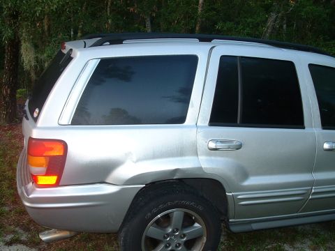 1995 Ford Bronco - This silver SUV has visible damage to its rear passenger side.