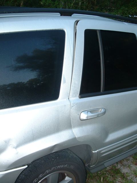 1995 Ford Bronco - This silver SUV has significant damage to its rear quarter panel and rear door.