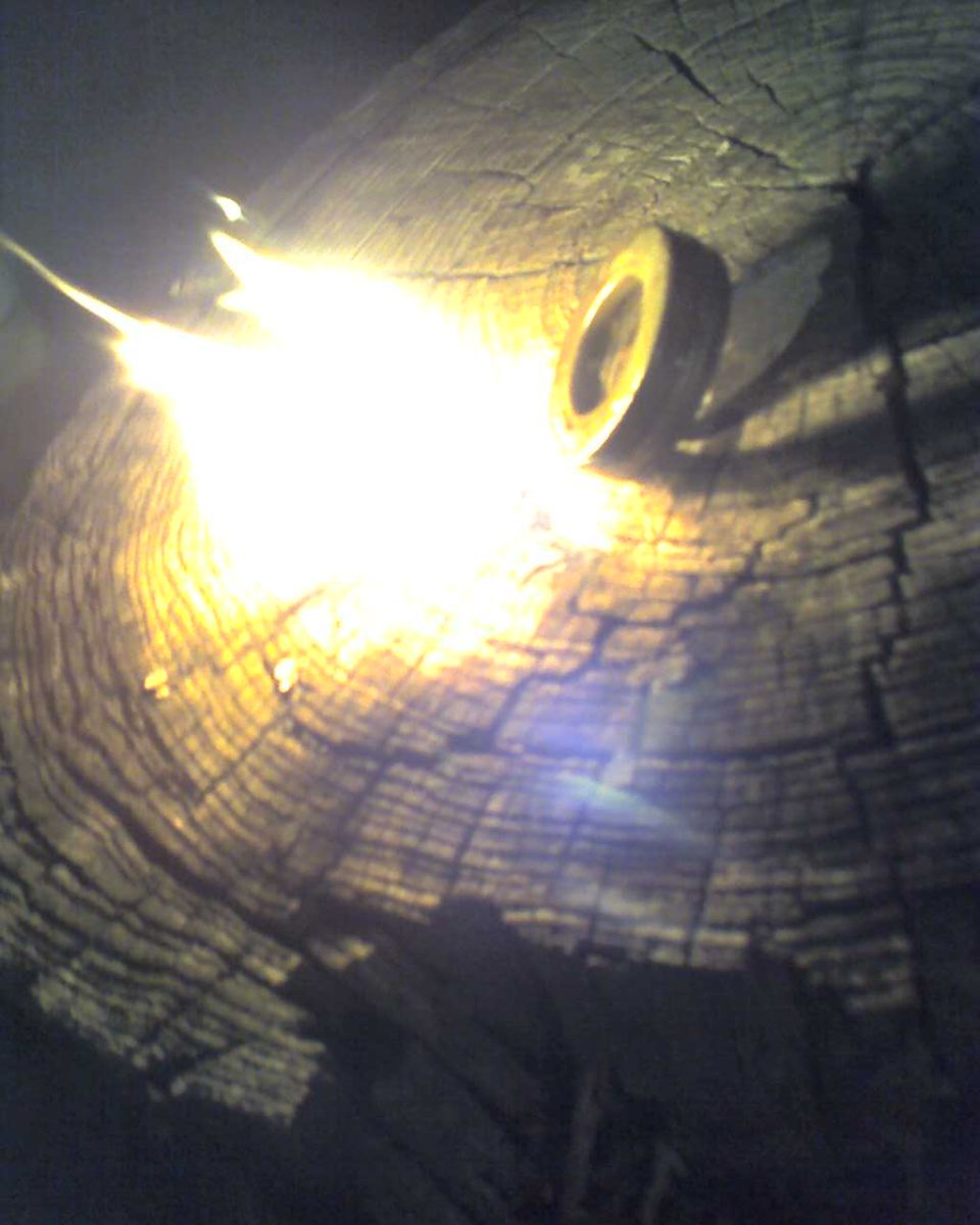 metal ring on cracked wood with bright light