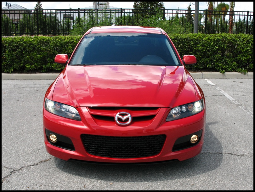 Red 2006 Mazda 6 sedan front view, parked in a lot