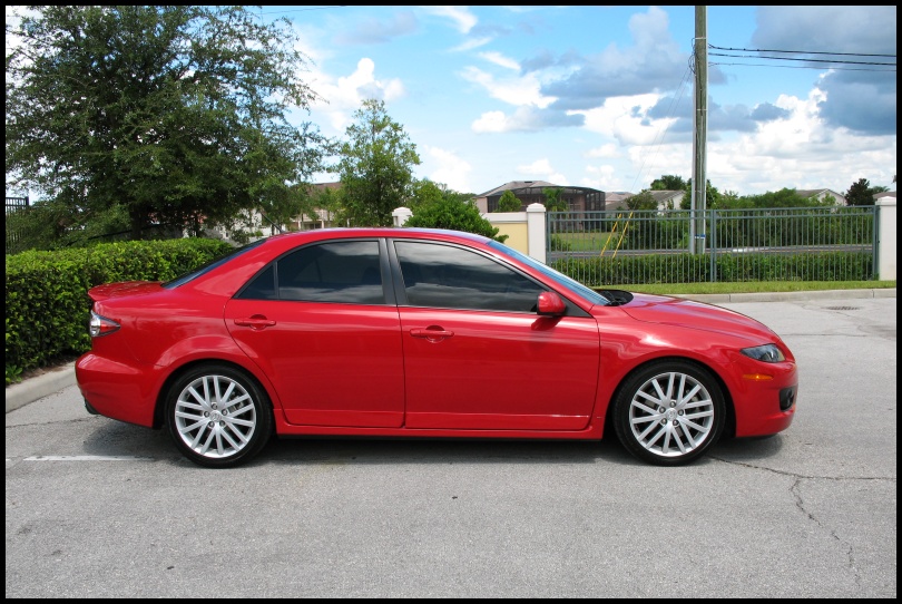 Red sedan, side view. 2006 Mazda 6