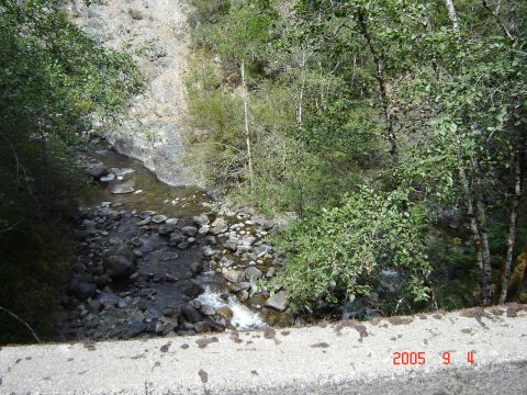 1993 Ford Bronco - A creek flows through a rocky canyon surrounded by trees. A watermark indicates the photo was taken on September 11, 2005.