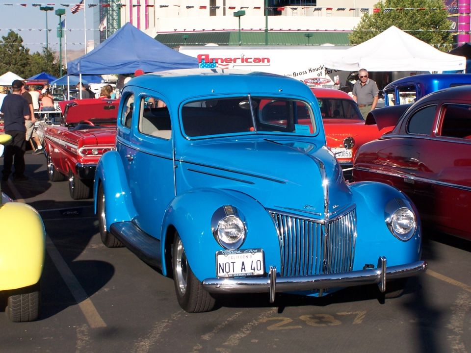 Blue sedan with a chrome grille and a license plate reading 'NOT A 40'