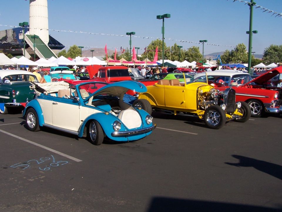 Blue and white convertible Volkswagen Beetle, front view, hood open