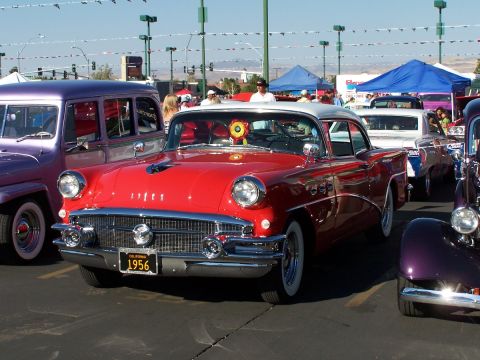 1990 Ford Bronco - Front view of a red 1956 Buick Special at a car show, with other vehicles visible.