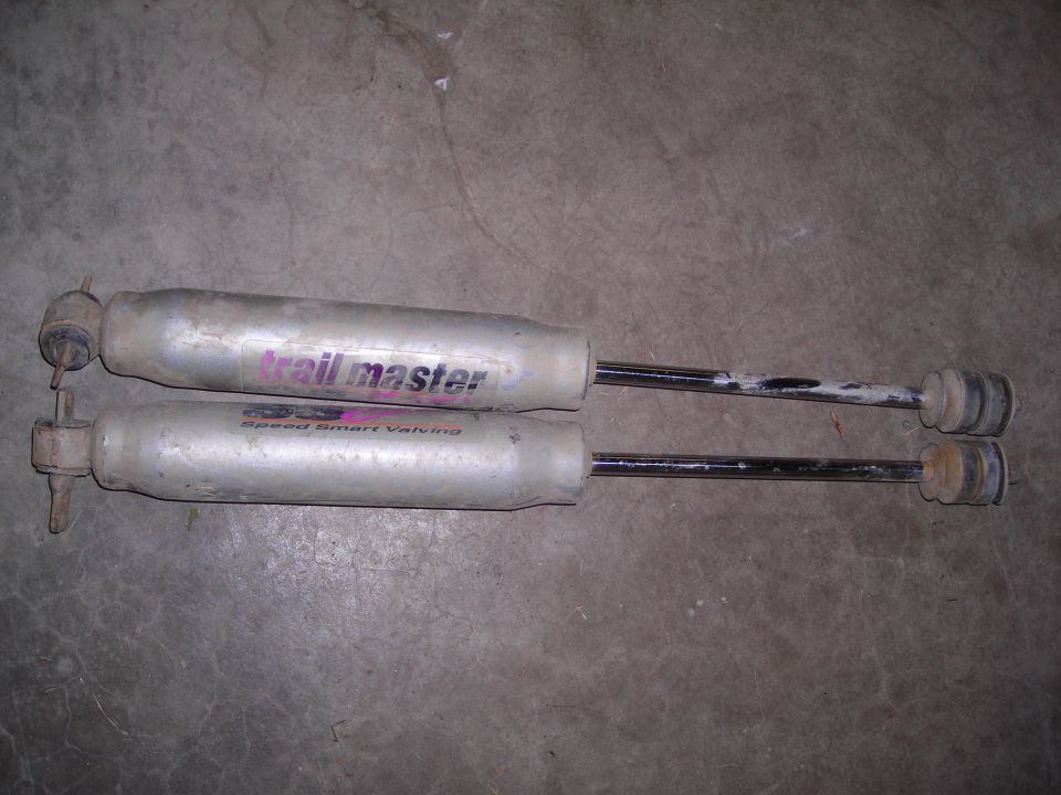 Two Trail Master shock absorbers with Speed Smart Valving labels