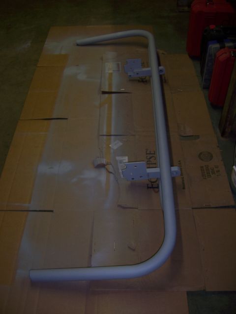 1991 Ford Bronco - A custom rear bumper is being fabricated and painted, laid out on cardboard for protection.