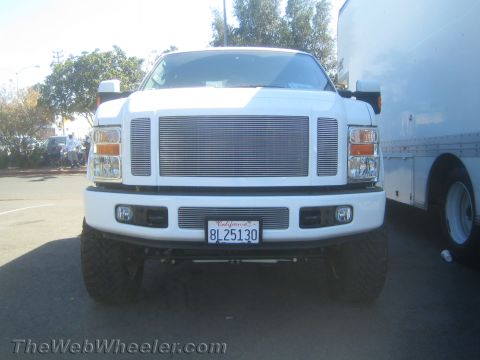 1968 Ford Mustang - This white Ford F-250 truck has a distinctive chrome grille and California plates.
