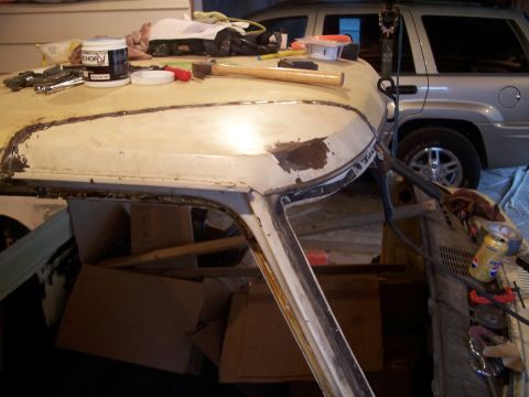 1979 Ford F-150 - Work in progress on a vehicle's roof, with tools and materials laid out. Another vehicle is parked behind.