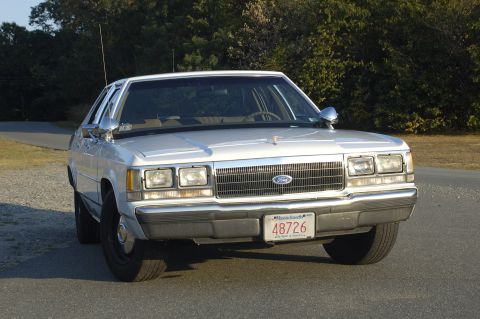 1991 Ford Crown Victoria LTD - Front view of a white 1991 Ford Crown Victoria LTD, displaying Massachusetts license plate 48726.