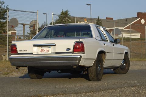 1991 Ford Crown Victoria LTD - This 1991 Ford Crown Victoria LTD is seen from the rear, displaying its Massachusetts license plate.