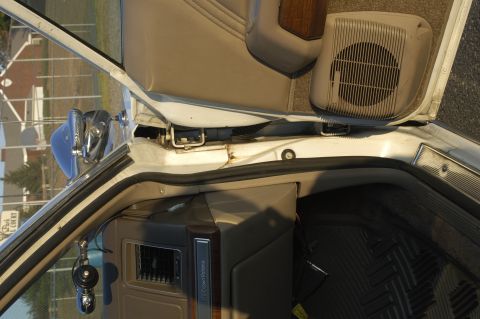 1991 Ford Crown Victoria LTD - The interior of a 1991 Ford Crown Victoria LTD is visible, including the door panel and speaker.
