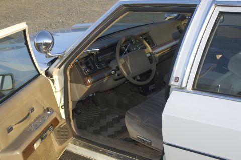 1991 Ford Crown Victoria LTD - Interior view of a 1991 Ford Crown Victoria LTD, highlighting the dashboard and driver's side.