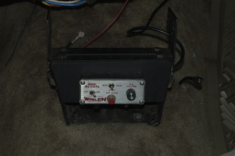 1991 Ford Crown Victoria LTD - Close-up of a Whelen WS-310-PA siren control unit, likely installed in a vehicle's interior.