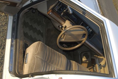 1991 Ford Crown Victoria LTD - Interior view of a 1991 Ford Crown Victoria LTD, showing the driver's side seat and dashboard.