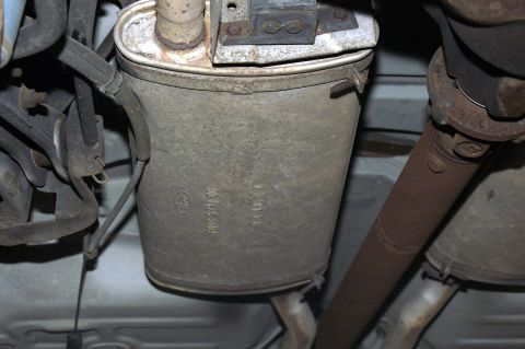 1991 Ford Crown Victoria LTD - Underside view of a vehicle's exhaust system, showing the muffler and driveshaft.