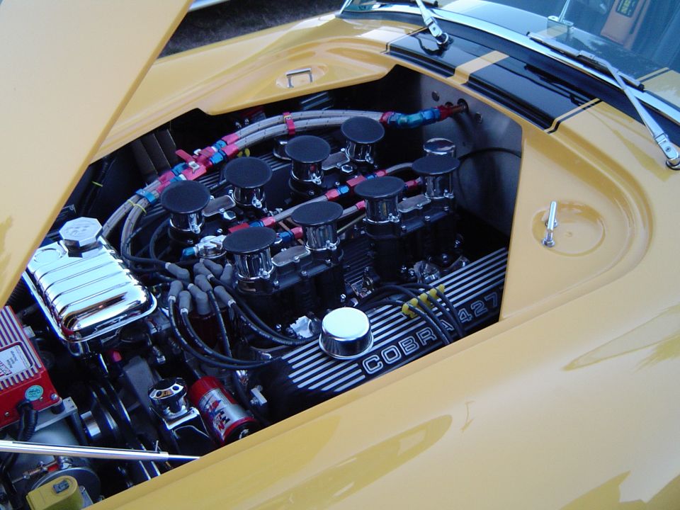 Cobra 427 V8 with eight stack air cleaners and black finned valve covers
