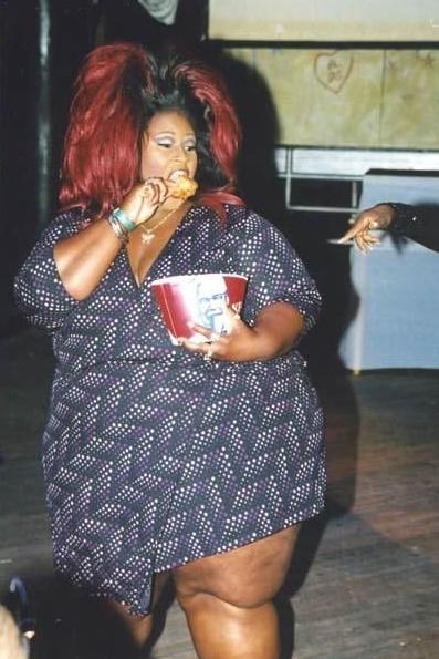 1996 Ford Bronco - A woman enjoys a meal of fried chicken from a KFC bucket.