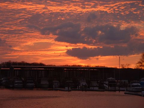 1994 Ford Bronco - Sunset over a marina filled with docked boats.