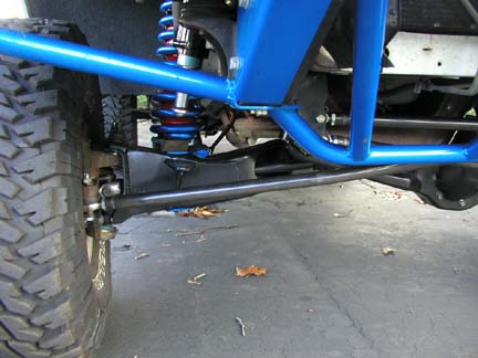 1984 Ford Bronco - Close-up view of off-road vehicle suspension and roll cage with a Supermotors.net watermark.
