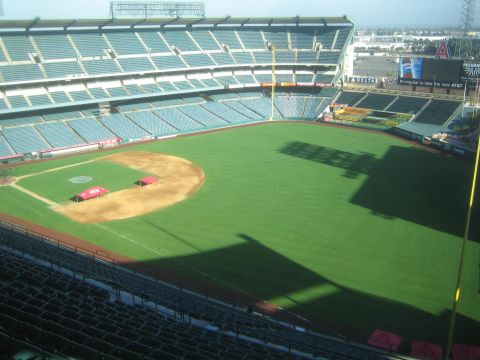 1990 Ford Bronco - View from the upper deck of an empty baseball stadium showing the green outfield, diamond and tiered seating.