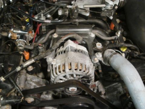 2000 Ford Crown Victoria - Close-up view of a vehicle's engine bay, showing various components and wiring.