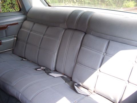 1999 Ford Crown Victoria - Interior view of a rear bench seat with seatbelts.