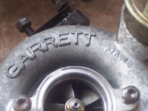 1994 Ford Probe - Close-up of a Garrett turbocharger, showing the brand name and an "AIR .43" marking.
