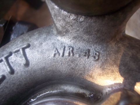 1994 Ford Probe - A close-up view of a turbocharger housing shows cast-in markings, including 'A/R .48'.