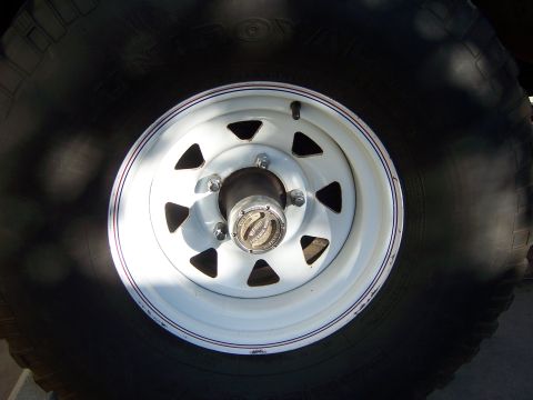 1991 Ford Bronco - Close-up of a Warn premium hub, a part for a 4x4 vehicle.
