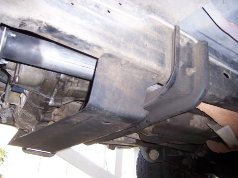 1991 Ford Bronco - Close-up view of the undercarriage, showing a skid plate and exhaust system.