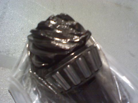 1994 Ford Bronco - This image shows a damaged differential gear and bearing, likely requiring replacement.
