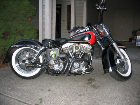 1964 Ford Fairlane - Custom motorcycle parked in front of a garage.