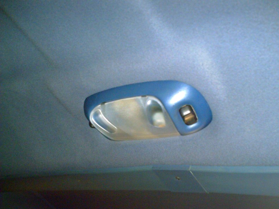 Interior dome light assembly with a blue housing and clear lens