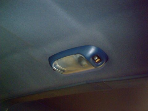 1990 Ford Bronco - Close-up of a vehicle's interior dome light fixture.