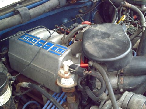 1990 Ford Bronco - Aftermarket 'FORD SPEED' intake manifold on a Ford engine.