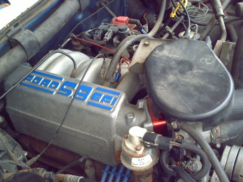 1990 Ford Bronco - Close-up view of a Ford 5.8 EFI engine, showing the intake manifold and associated components.